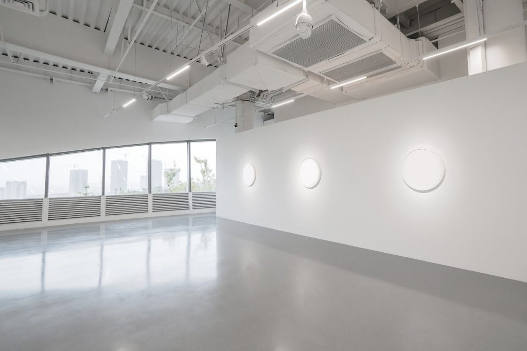 Wide view of a metallic epoxy floor of an empty museum