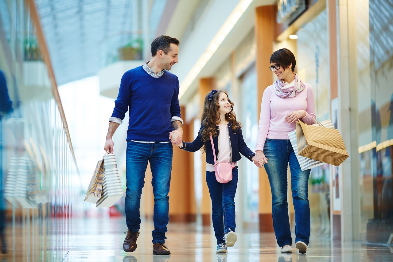 Parents and their daughter going shopping