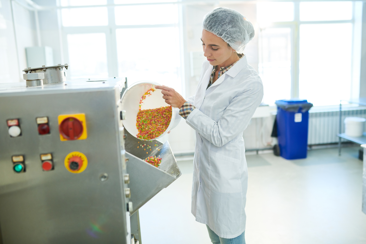 A woman working in a food facility with PU mortar flooring