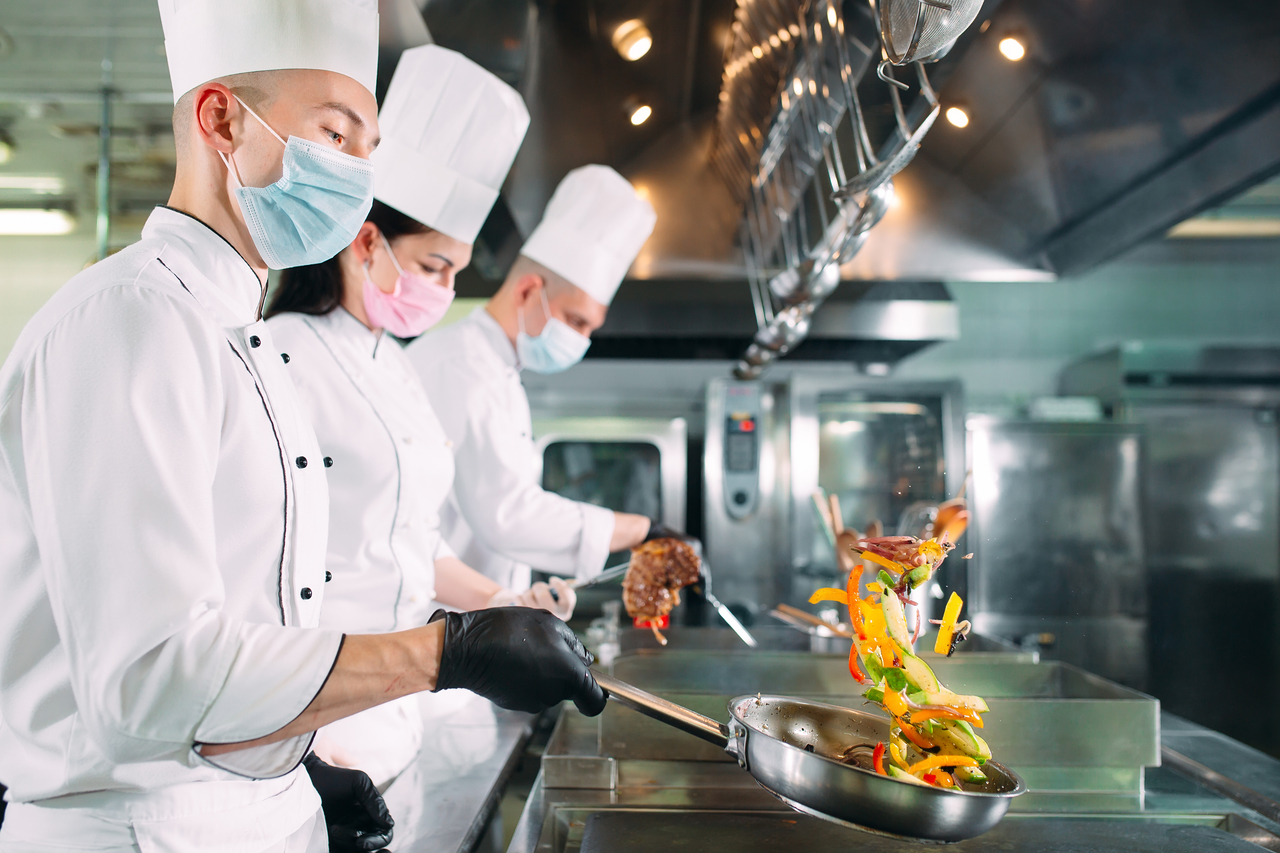 Chefs in face masks at work