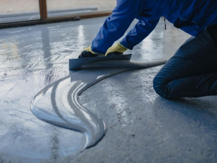 Professional waterproofing application by Flooring Solutions