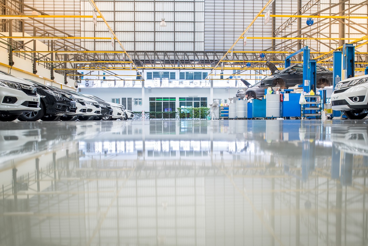 Low angle picture of metallic epoxy flooring in a auto repair shop