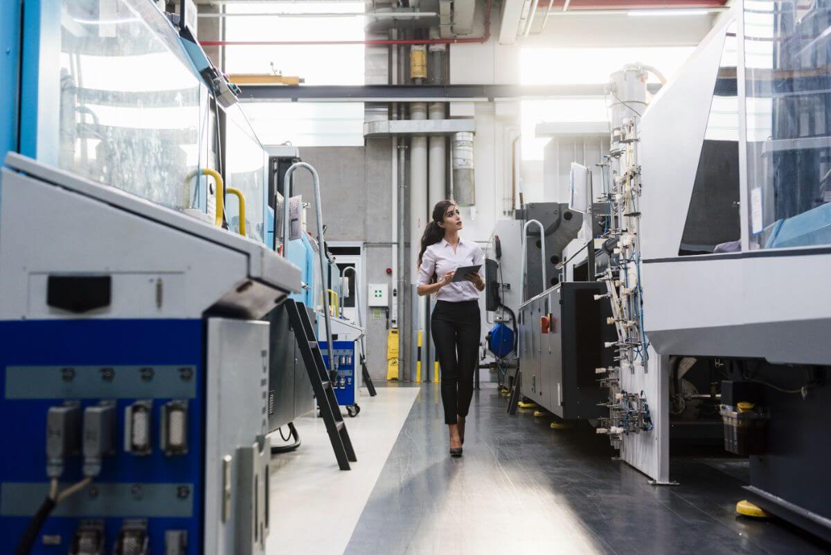 Woman With Tablet At Machine In Factory Shop Floor 2022 11 06 23 11 20 Utc